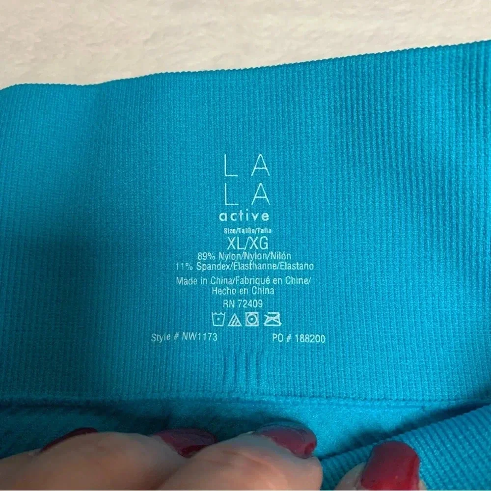 LA LA active biker shorts teal color size XL NWT has texture to them